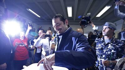 Former Lebanese prime minister Saad Hariri, centre, leader of Lebanon's parliamentary majority, casts his vote at a polling station during the municipal elections in Beirut, Lebanon on May 8, 2016. Hassan Ammar/AP Photo