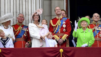 Queen Elizabeth watches the Trooping the Colour to mark her 90th Birthday in 2016 with Camilla, Duchess of Cornwall, Prince Charles, Catherine, Duchess of Cambridge, Princess Charlotte, Prince George, Prince William, Prince Harry, and Prince Philip. Getty Images
