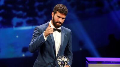 Liverpool's Alisson with the Goalkeeper of the Season award. Reuters