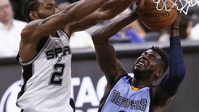 Memphis Grizzlies forward James Ennis gets his shot blocked by San Antonio Spurs forward Kawhi Leonard n the second half of their play-off game in San Antonio, Texas, on April 17, 2017. Larry W Smith / EPA