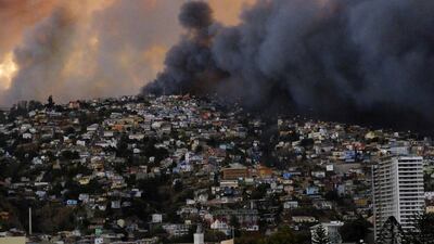 Ambulance crews treated residents for smoke inhalation as the fire engulfed block after block and set off some small explosions. (Cesar Pincheira / Reuters / April 12, 2014)