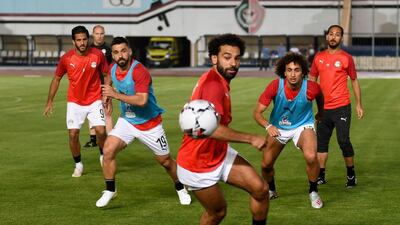Egypt's Mohamed Salah, centre, takes part in a training session two days ahead of hosting the 2019 African Cup of Nations. Egypt's first match is against Zimbabwe in Cairo on Friday. AFP