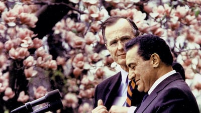 Hosni Mubarak prepares to makes a speech in the Rose Garden 03 April 1989, in Washington,DC, as former US President George Bush looks on. AFP