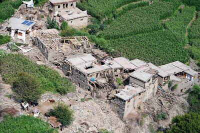 Damaged houses in Mazar Dara village, typical low-rise, mud-brick homes that are vulnerable to collapse. AFP