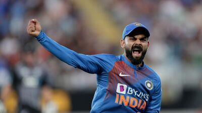 India captain Virat Kohli celebrates after catching out New Zealand’s Martin Guptill at Eden Park during the second Twenty20 match. AFP