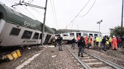 At least three people were killed and 10 seriously injured when a packed commuter train derailed near Milan in northern Italy. Flavio Loscalzo / EPA