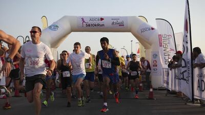 More than 700 people took part in 5K and 10K runs organised by Abu Dhabi striders to raise awareness of breast cancer. Lee Hoagland / The National