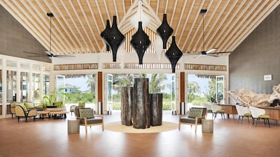 The reception area of Le Meridien Maldives Resort & Spa is an open space, called the Hub.