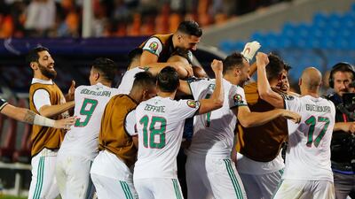 Algerian players celebrate after beating Nigeria 2-1 in their Africa Cup of Nations semi-final in Cairo. AP Photo
