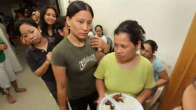 Women stranded in the UAE and sheltered at the Filipino Workers Resource Centre at the Philippine overseas labour office in Dubai share the iftar meal.