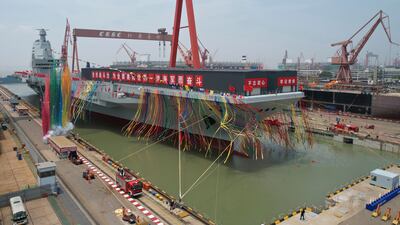 In this photo released by Xinhua News Agency, coloured smoke marks the launch of the 'Fujian'. AP