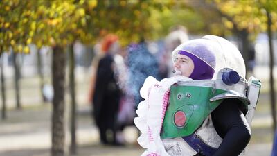 A cosplayer dressed as Buzz Lightyear. PA