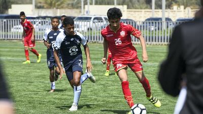 Bahrain National team (red) vs. Legends soccer team from South Africa (white/blue) under 14 age group.