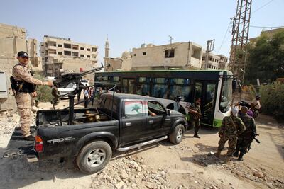 People evacuate the town of Daraya, outside the capital Damascus, by bus on August 26, 2016. AFP