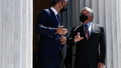 Greek Prime Minister Kyriakos Mitsotakis greets King Abdullah II during the Trilateral Greece, Cyprus, Jordan Summit, in Athens.