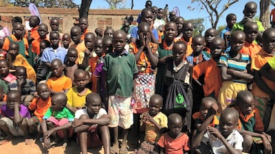 South Sudanese refugee children gather to welcome a delegation from Dubai Cares in Adjumani, Uganda. Roberta Pennington for The National
