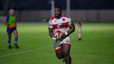 Deanne Makoni of Dubai Tigers runs through for his try against Doha
