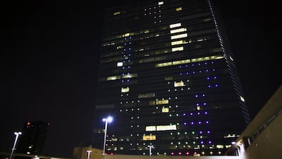 The hundreds of LED lights embedded in the building’s glass facade normally display colourful patterns. On Saturday night, images of supersized shapes “fell” on two sides of the mirrored tower as competitors used joysticks to manoeuvre them, creating a spectacle against the night sky that organisers hoped inspired onlookers and players to think about the possibilities of technology. Joseph Kaczmarek / AP Photo