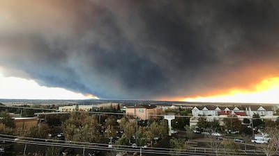 The massive plume from the Camp Fire wafts over the Sacramento Valley as seen from Chico, California. Chico Enterprise-Record / AP