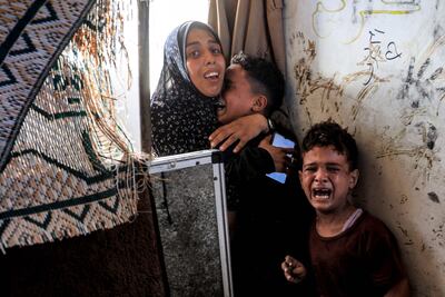 Palestinian children take refuge at the Jaouni UNRWA-run school in Nuseirat in the Gaza Strip on July 6. AFP
