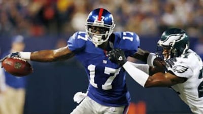 The New York Giants wide receiver Plaxico Burress has been given a four game ban.