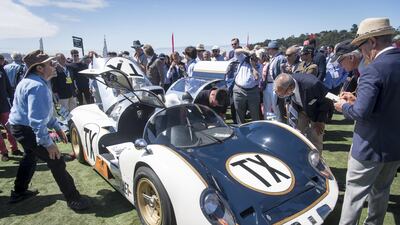 Attendees view a 1958 Howmet Turbine Experimental (TX) Coupe. Bloomberg