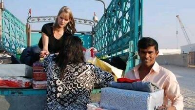 Adopt-a-Camp volunteers gather goods to be packed and sent to labourers in camps as part of the Ramadan charity campaign.