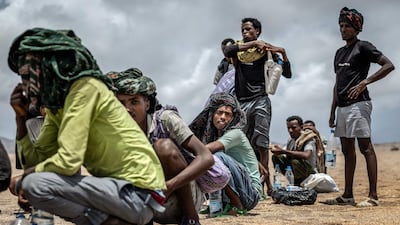 Ethiopian migrants take a breather in a remote desert area during their journey along the so-called Eastern Route, returning from a failed attempt to cross into Yemen. AFP