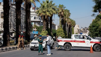 A police vehicle near the cafe in central Damascus. Reuters