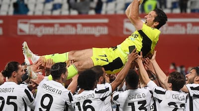 Juventus' Gianluigi Buffon is tossed up by teammates after winning the Coppa Italia. Reuters