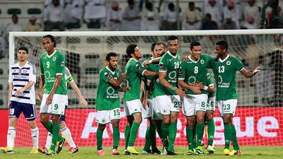 Al Shabab, in green, were dominant against Al Ain on Sunday night. Satish Kumar / The National