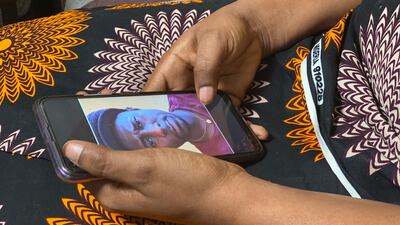 Anifa holds her phone displaying a photo of former World Health Organisation doctor Boubacar Diallo, during an interview in the eastern Congo town of Goma. Photo: AP