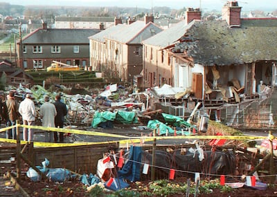 Residents of Lockerbie look at the devastation after Pan Am Flight 103 exploded over the town. AFP