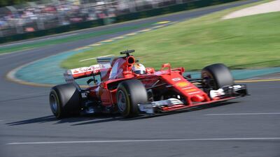 Ferrari's German driver Sebastian Vettel powers through a curve during the Formula One Australian Grand Prix in Melbourne on March 26, 2017. William West / AFP