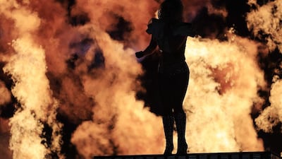 Gaga commanded a large troupe of dancers and musicians, props that breathed fire and audience members swinging lights in synchronisation — the usual excess that has become a Super Bowl cliche. Tannen Maury / EPA