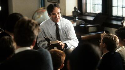 Robin Williams teaching a class in the 1989 film Dead Poets Society. Photo by Touchstone Pictures / Getty Images