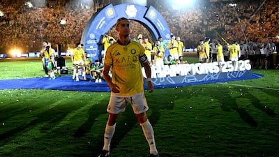 Al Nassr captain Cristiano Ronaldo looks out to the crowd as his team celebrate their title win. EPA