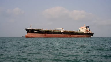 An oil tanker anchored in the Strait of Hormuz as the key channel remains virtually closed. Getty Images