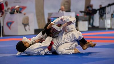 Wadima Al Yafei, left, on her way to gold at the Mubadala Arena on Saturday. Courtesy UAEJJF