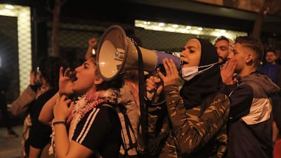 Lebanese students protest a decision by top universities to adopt a new dollar exchange rate to price tuition in Beirut's Hamra district. AFP