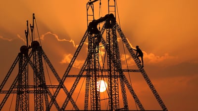 A worker climbs a fairground ride in Pushkar, north-western India. AFP