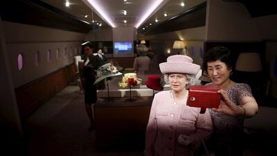 A woman takes a selfie with the wax figure of Britain’s Queen Elizabeth II at Grevin Wax Museum in Seoul, South Korea on July 30, 2015. Kim Hong-Ji / Retuers