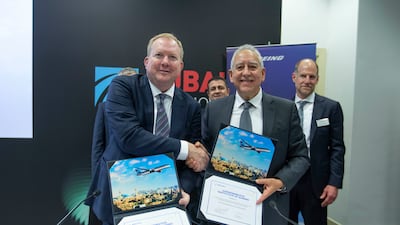 Stanley Deal, president and chief executive of Boeing Commercial Airplanes, left, and Samer Majali, chief executive of Royal Jordanian Airlines, at a signing ceremony during the Dubai Airshow on Monday. Leslie Pableo / The National