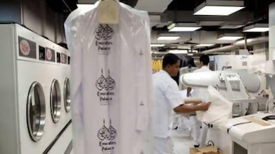A team of eight laundry staff clean guests' clothes, processing up to 10 tonnes a day when Emirates Palace hotel is working at full capacity. Christopher Pike / The National