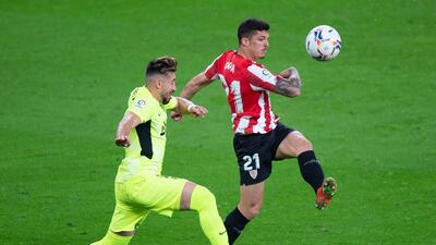 Atletico Madrid's Mexican midfielder Hector Miguel Herrera vies Athletic Bilbao's Spanish defender Ander Capa. AFP