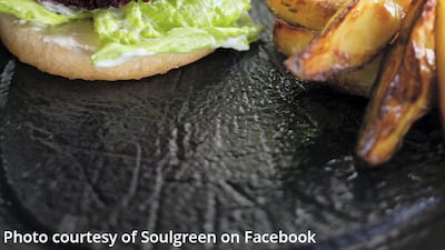 Soulgreen's Red Quinoa Burger features a patty made with quinoa and beetroot, doused with vegan mayo. It's served with chips and dips.