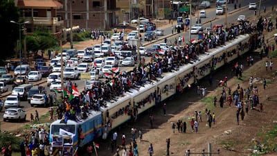 Sudanese civilians ride on the train to join in the celebrations of the signing of the Sudan's power sharing deal. REUTERS/Mohamed Nureldin Abdallah