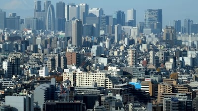 Tokyo's Shinjuku area. Japanese people earn less than their US counterparts but gain in other ways. AFP