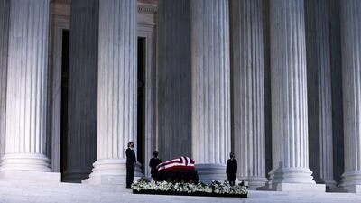Ginsburg's flag-draped casket rests on the Lincoln catafalque at the front of the US Supreme Court, on September 23, 2020. Getty / AFP