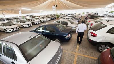 Brick-and-mortar establishments selling used cars, such as this one in Sheikh Zayed road in Dubai, are finding competition from the online marketplace. Jaime Puebla / The National